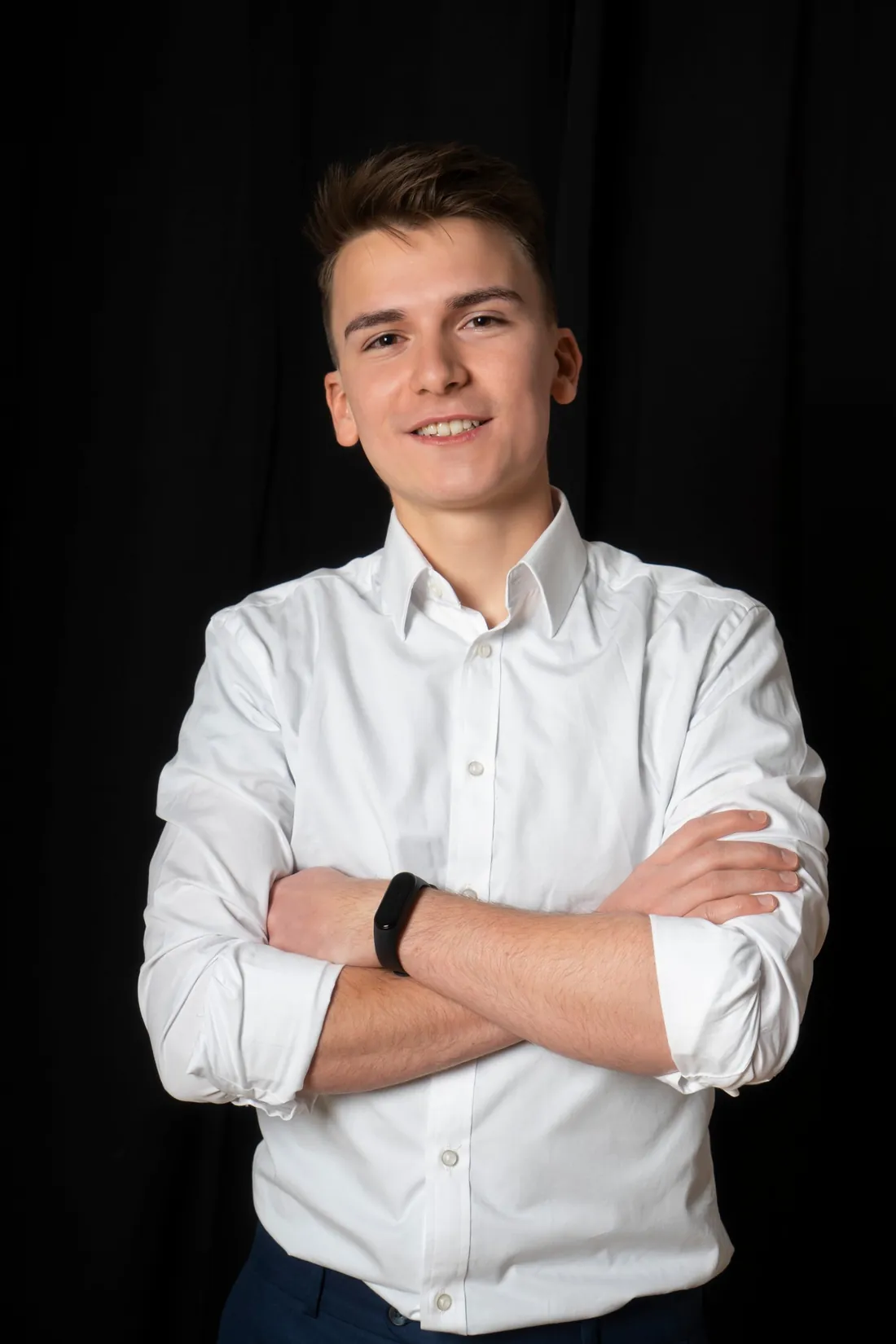 Andrzej Siedlecki smiling, arms crossed